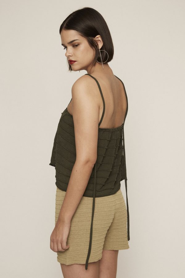 Deep green knit crop top. Featuring texture, braided details and straps with strings.