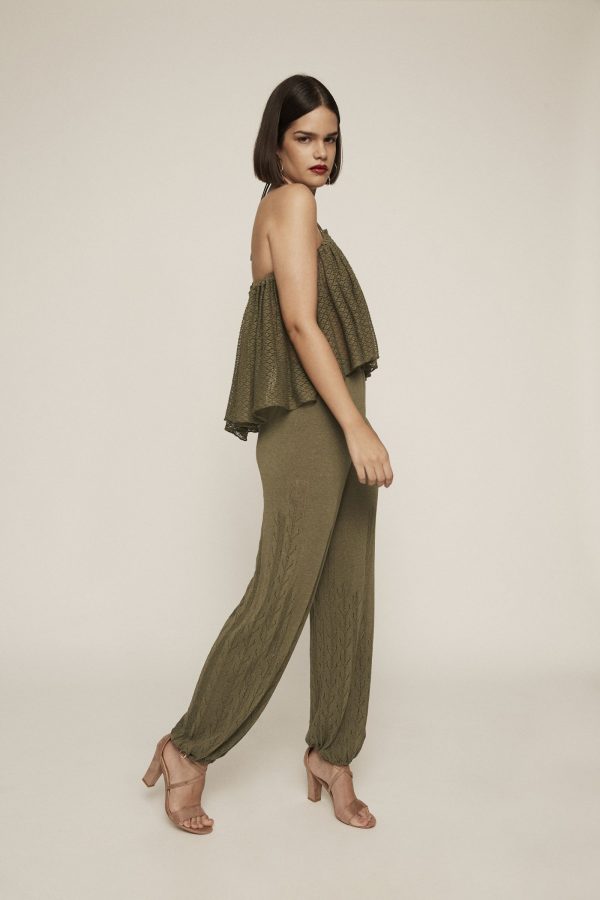 An absolute show-stopper. Dare to wear this draped tail-hem green knit crop top, which features a see-through texture and V strap