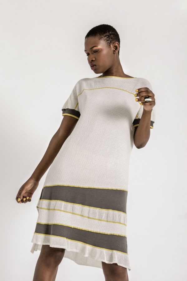 Delicate and empowering. Short sleeve A shape textured knit dress, with round neckline and contrasting details